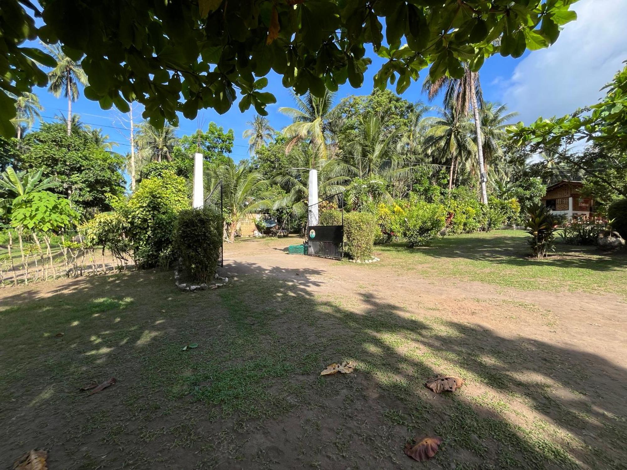 Paco'S Garden Home Stay Мамбахао Экстерьер фото