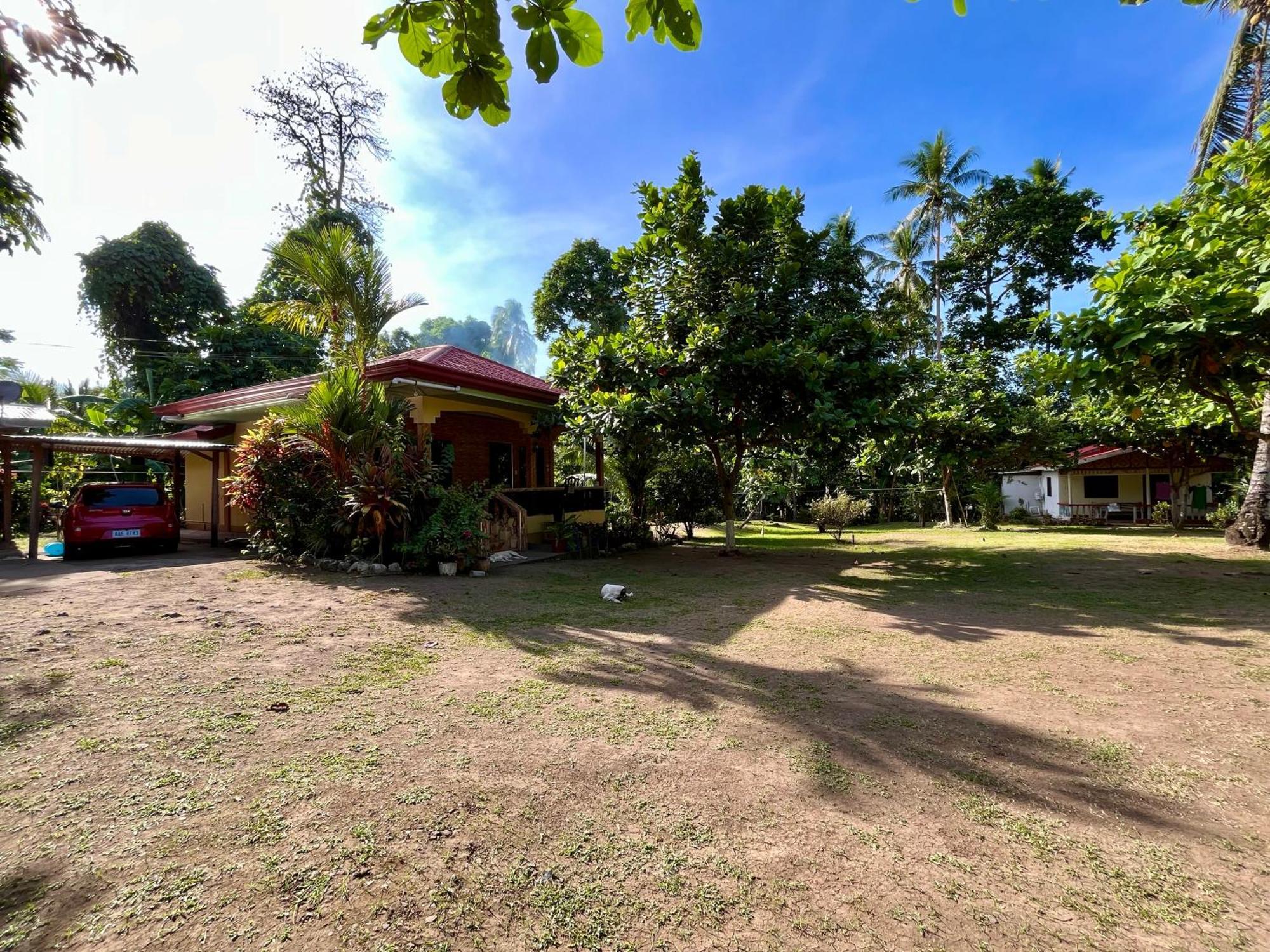 Paco'S Garden Home Stay Мамбахао Экстерьер фото